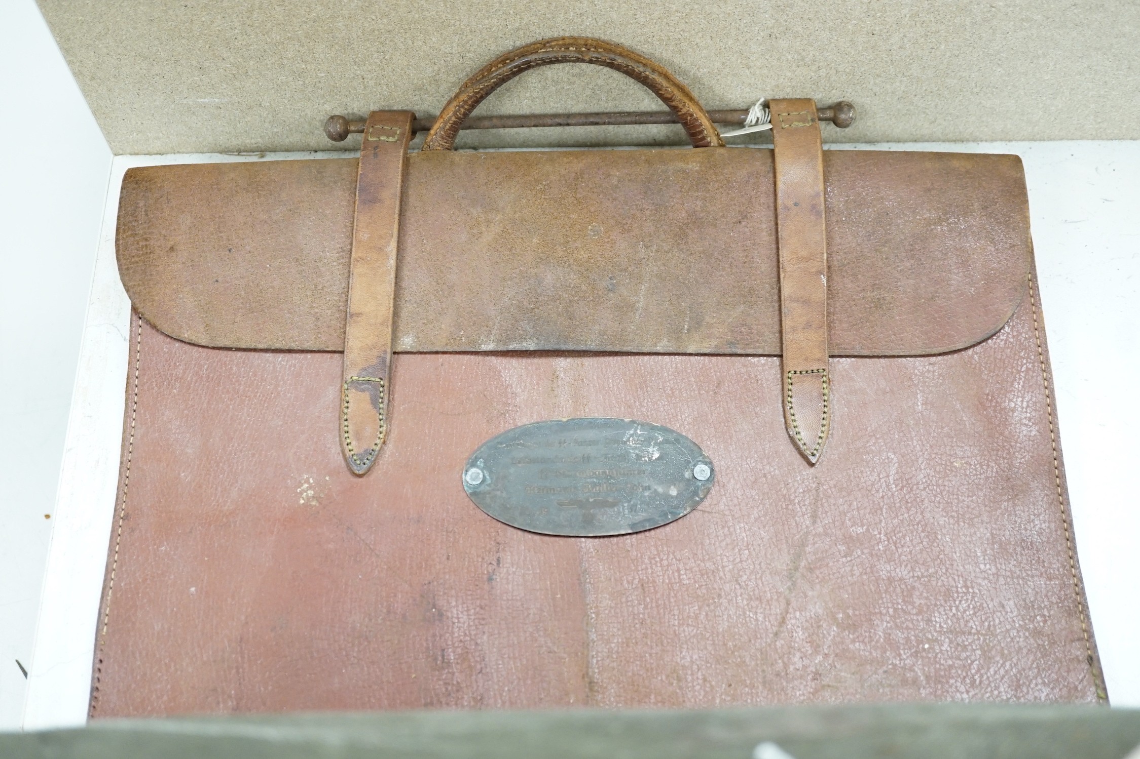 A satchel with George the VI monogram, a German Third Reich style satchel, a quantity of wartime maps and another satchel